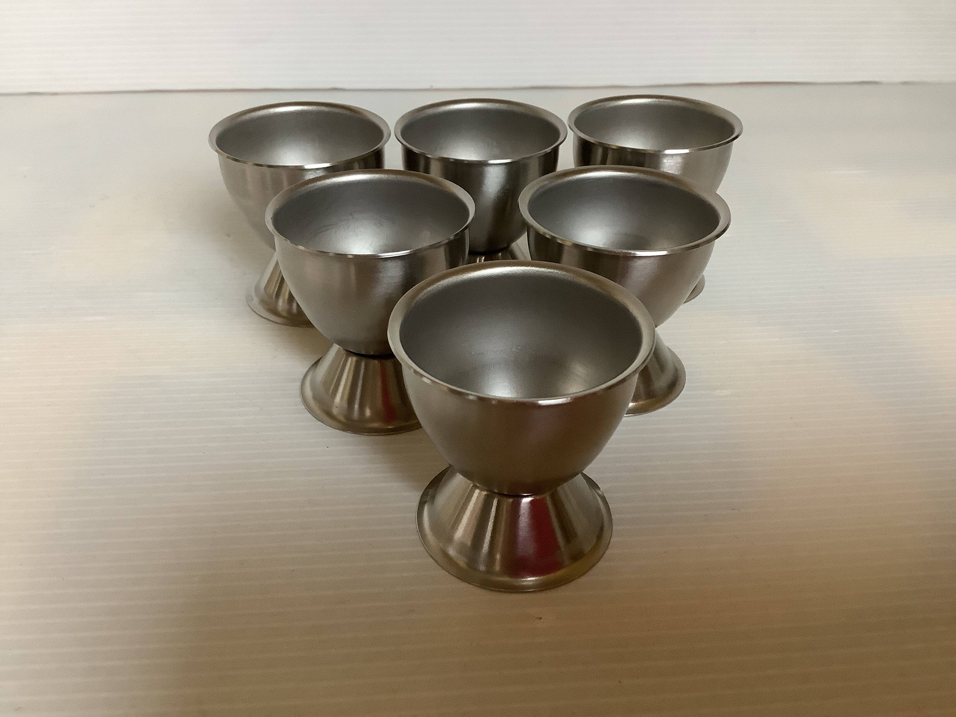 Six metal egg cups