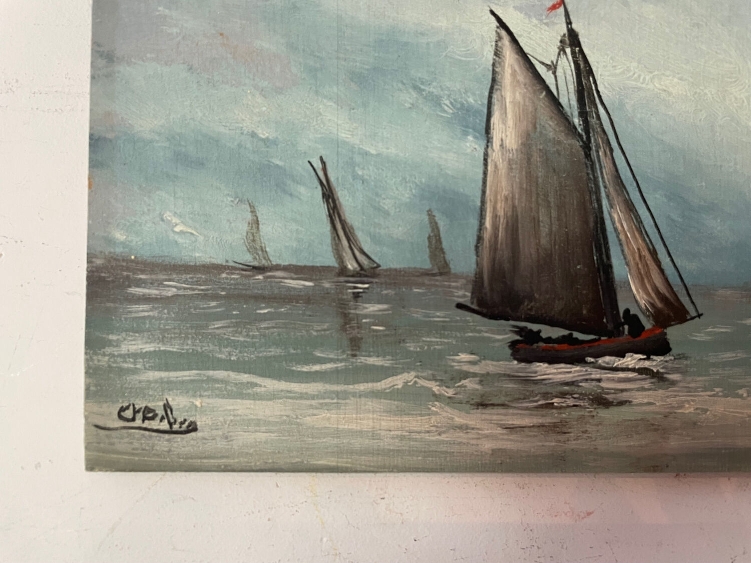 A pair of old paintings on wood.