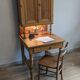 Former campaign secretary's desk in solid pine with a high cupboard.