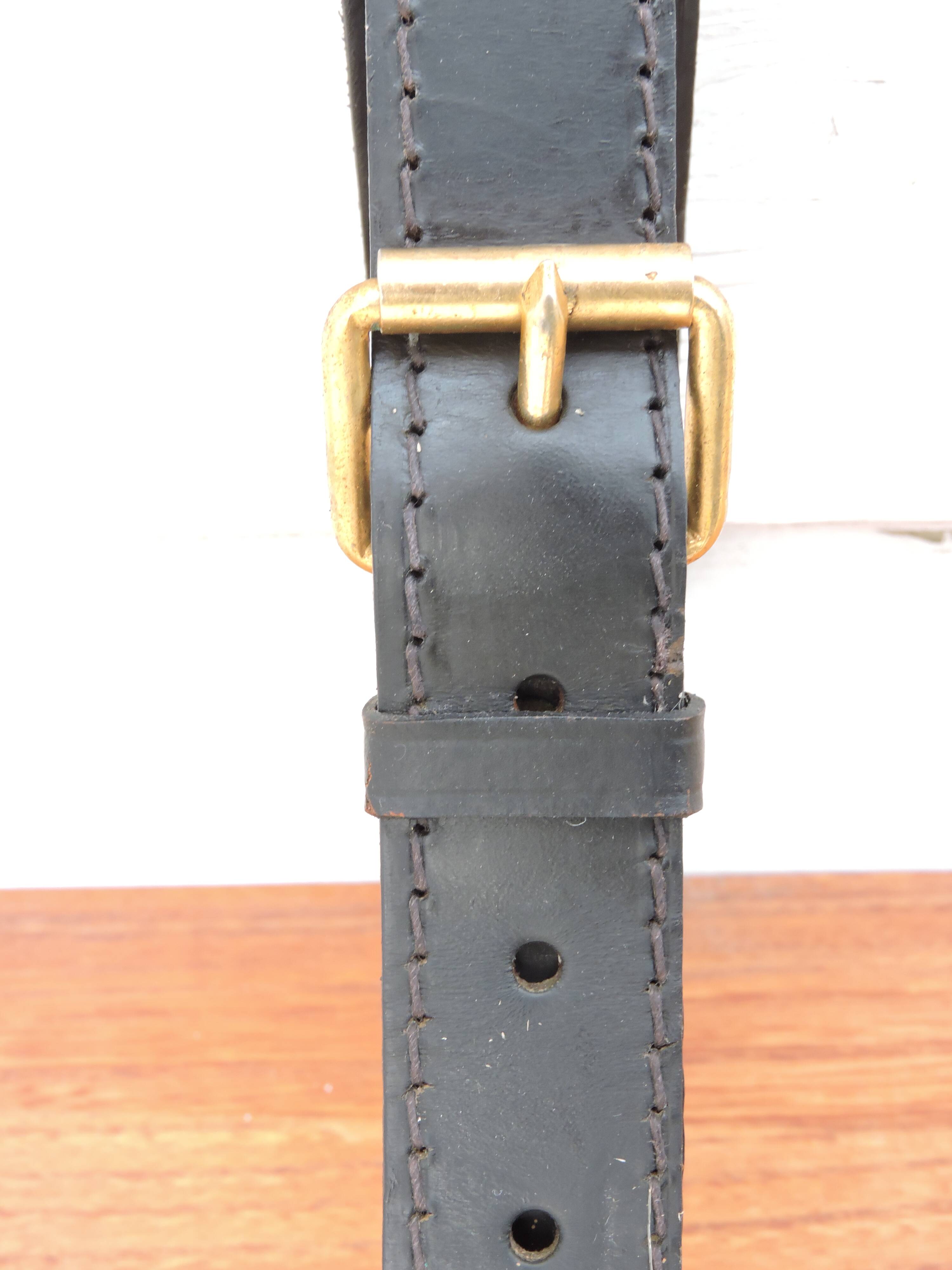 Elm and leather shelf, distributed by the Maison et Jardin Gallery in the 60