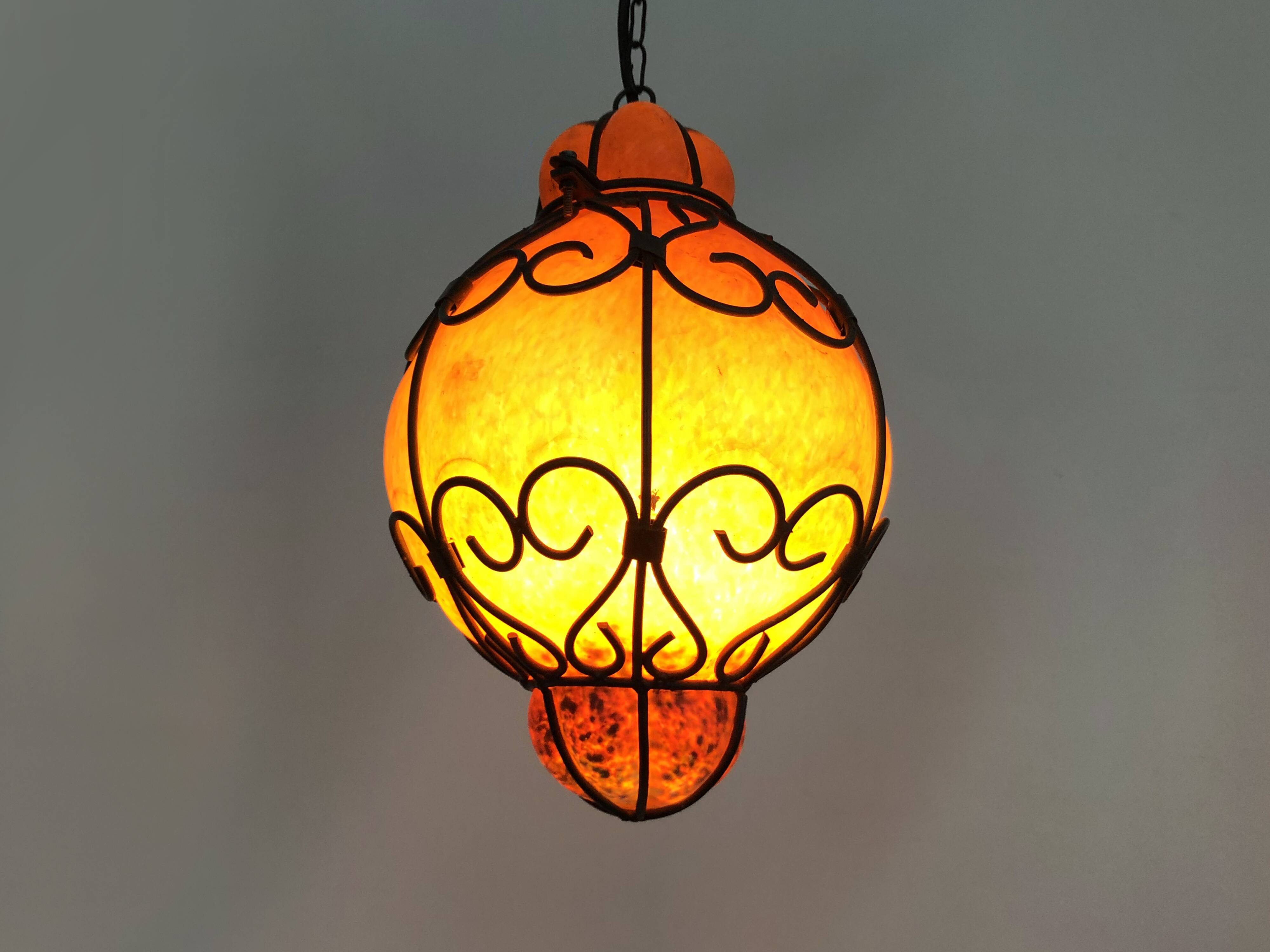 Venetian cage lantern suspension in orange and blue glass paste. Venetian lantern