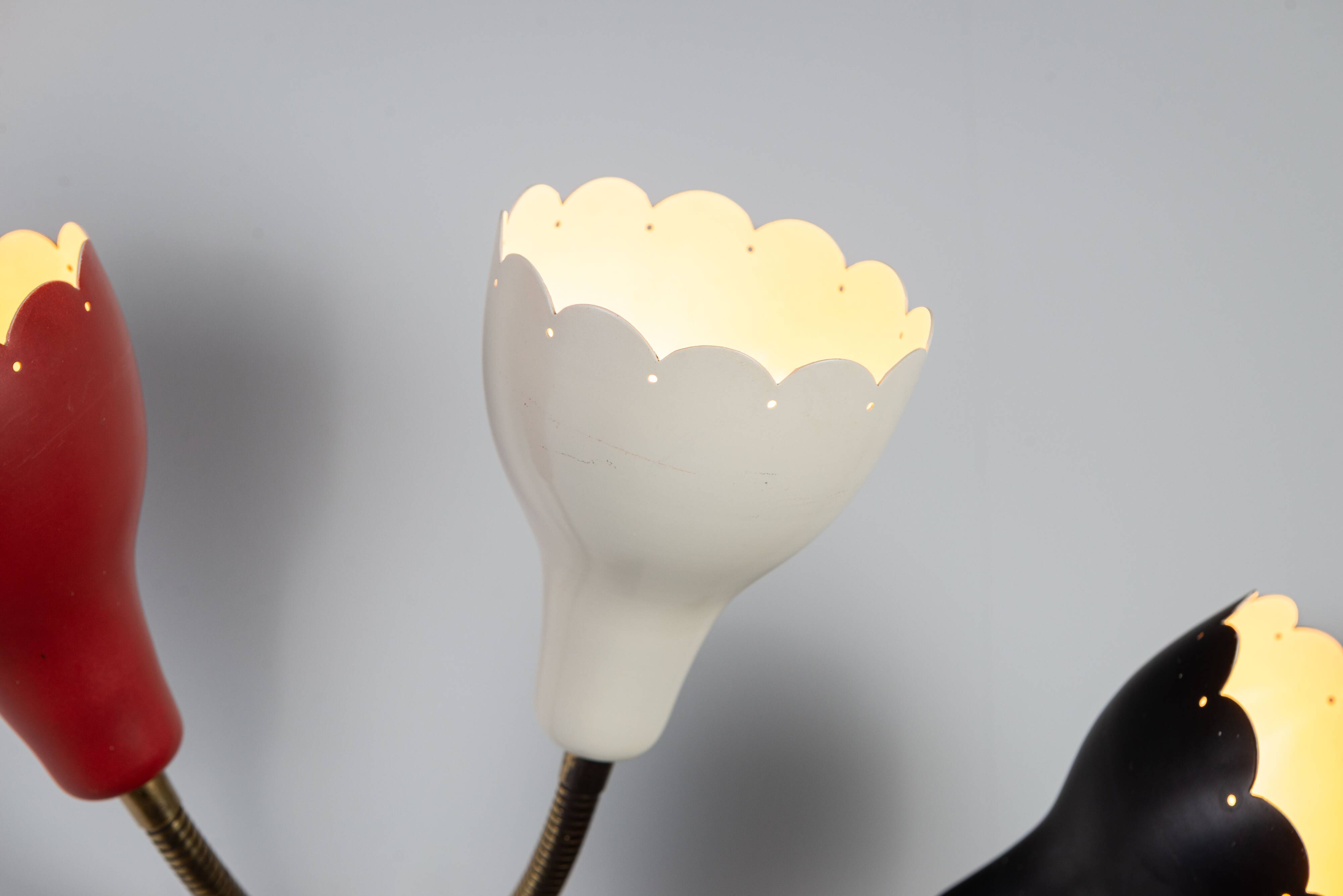 Adjustable wall lamp with three decorated shades in different colours