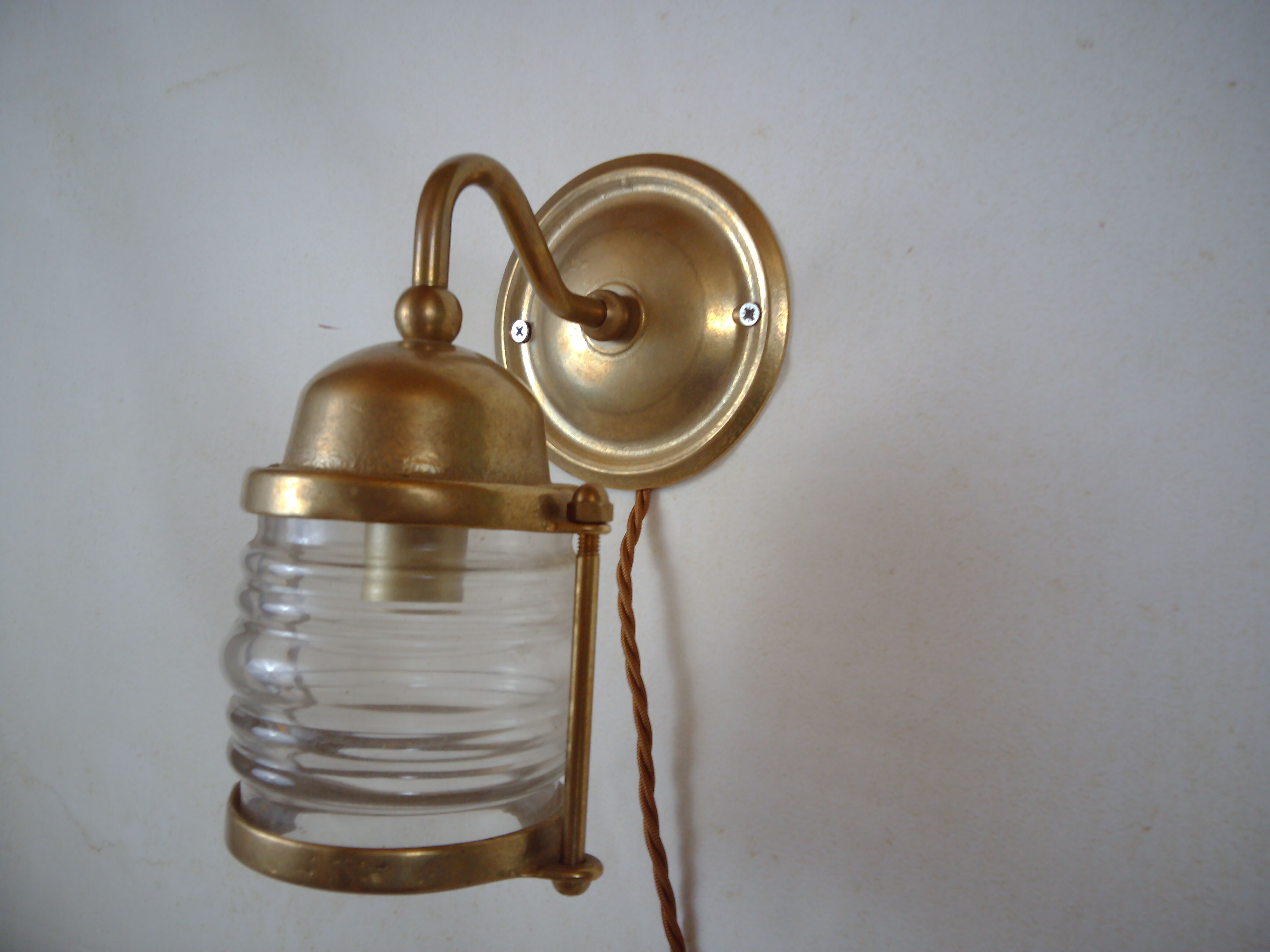 Vintage wallmounted brass lamp from a ship.