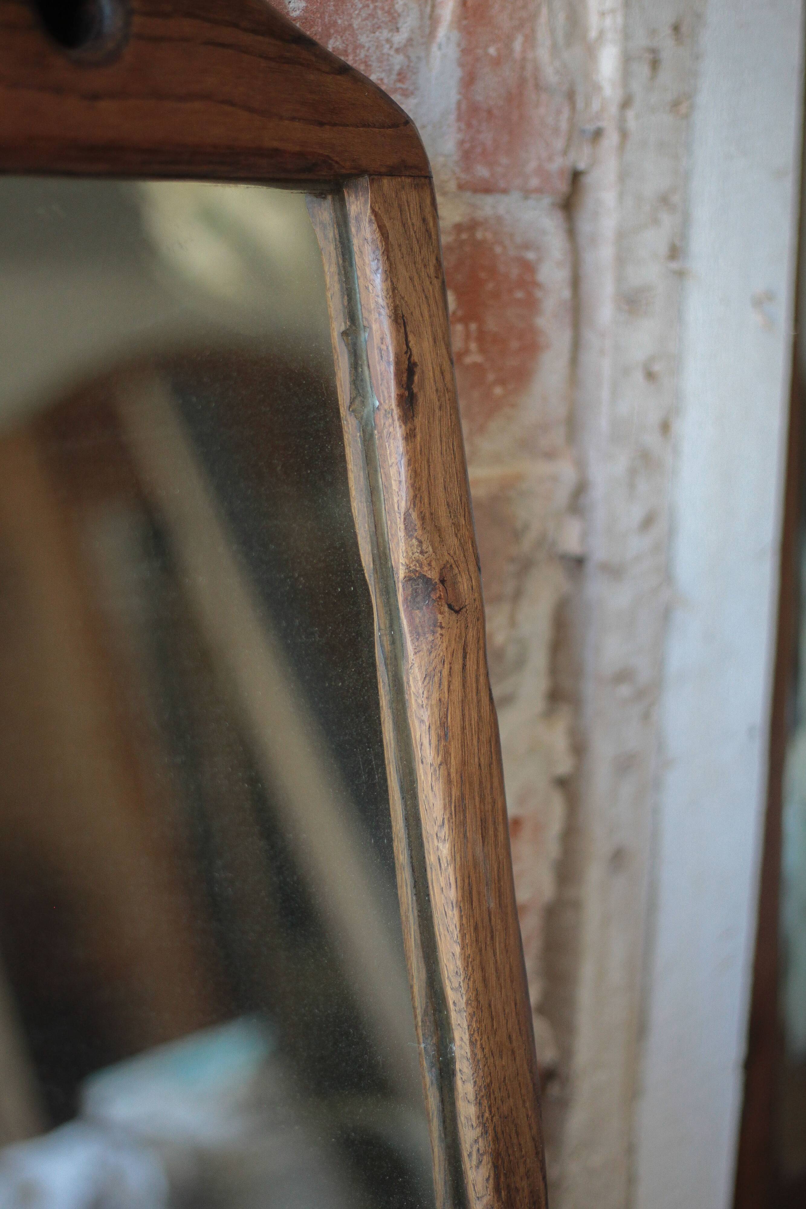 Wall-mounted coat rack mirror with solid wood hooks, brutalist mirror.