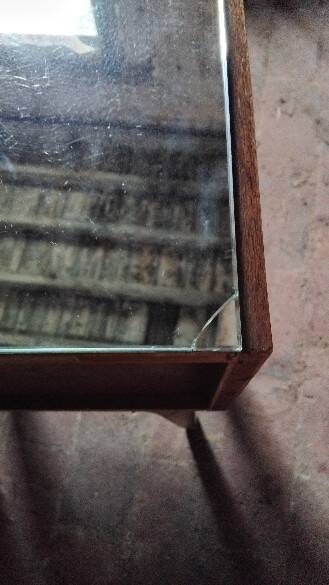 Vintage bedside table with a mirrored top, Art Deco style.