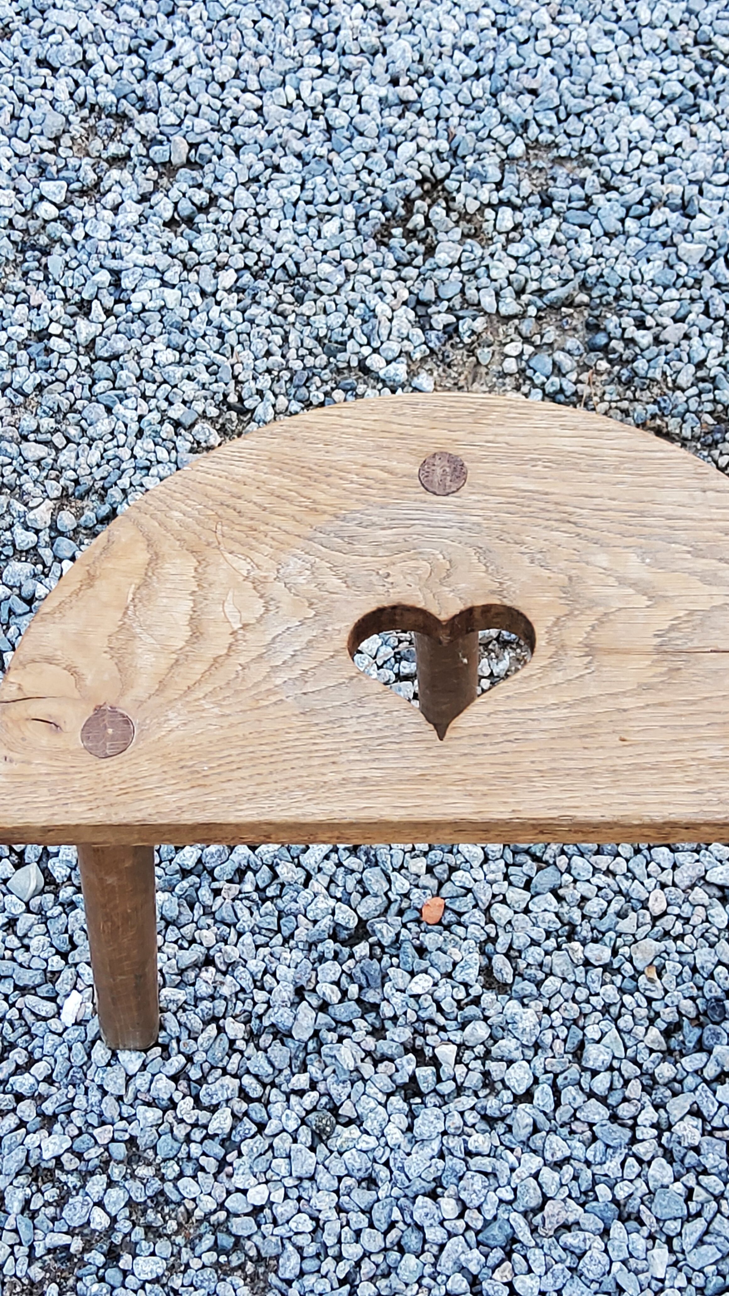 Pair of shepherd's stools in tripod oak décor in the heart