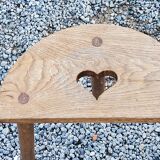 Pair of shepherd's stools in tripod oak décor in the heart