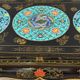 Black lacquered wooden coffee table with cloisonné and polychrome decoration, 20th century.