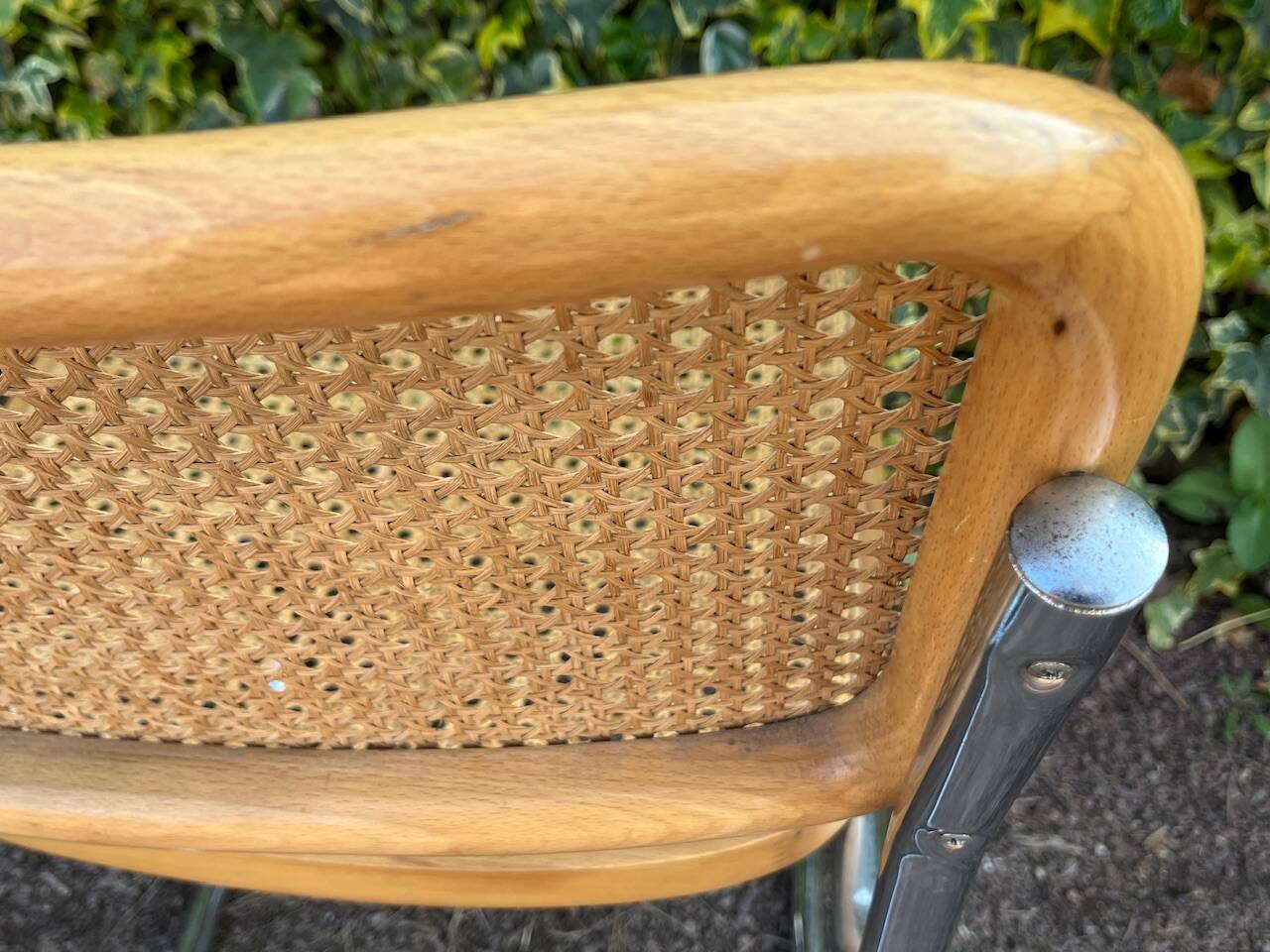 Wooden chair with caning in the style of Marcel Breuer.