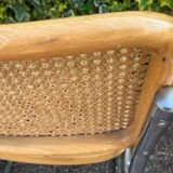 Wooden chair with caning in the style of Marcel Breuer.