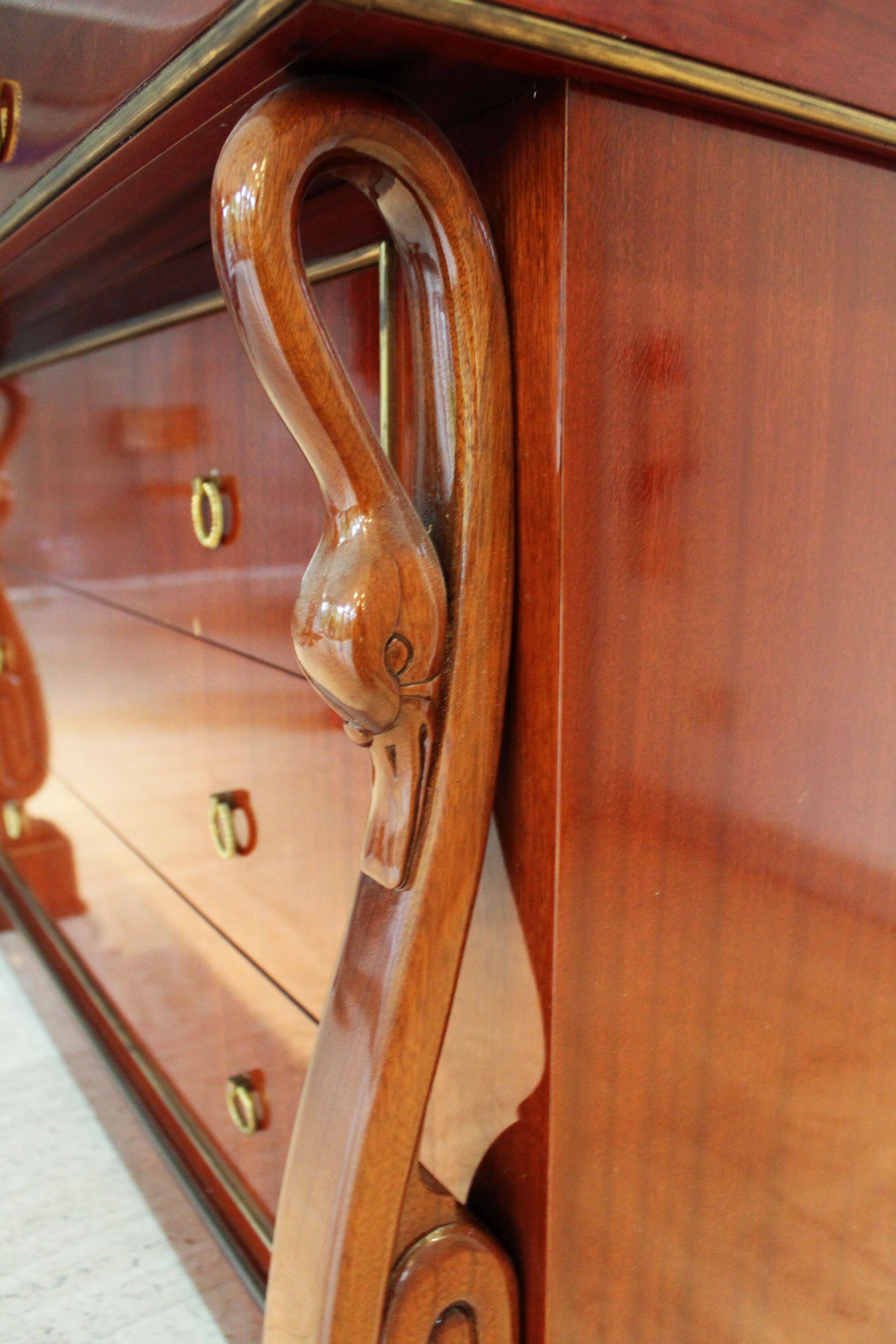 Mahogany “swan neck” chest of drawers, Empire style, 19th century.