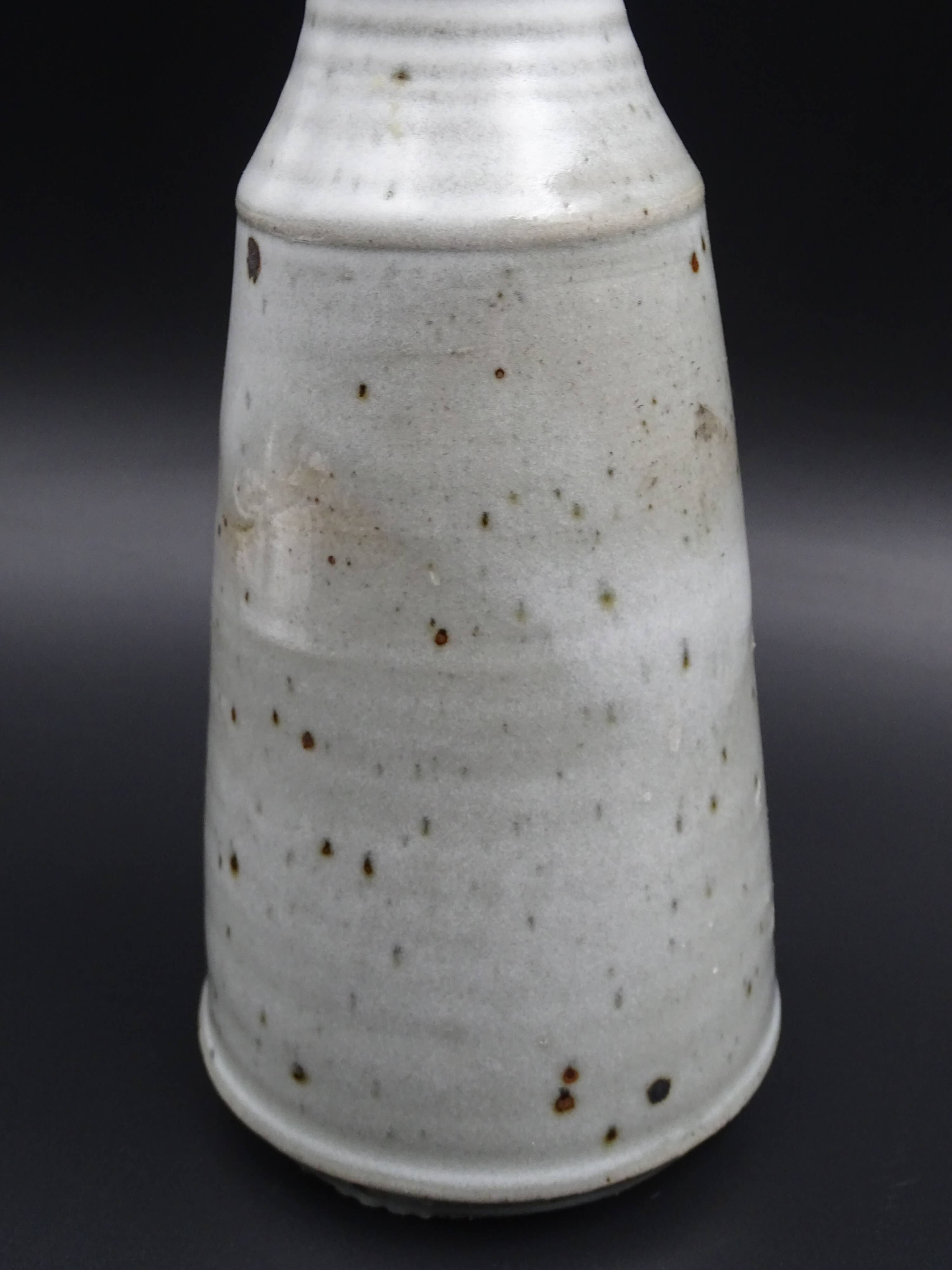 Sandstone vase with brown speckled decoration on a grey background - Bottle shape - Circa 1970 - Signed