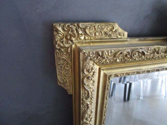 Large antique mirror in wood and gilded stucco.
