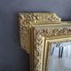 Large antique mirror in wood and gilded stucco.