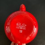 Théière rouge en tôle émaillée