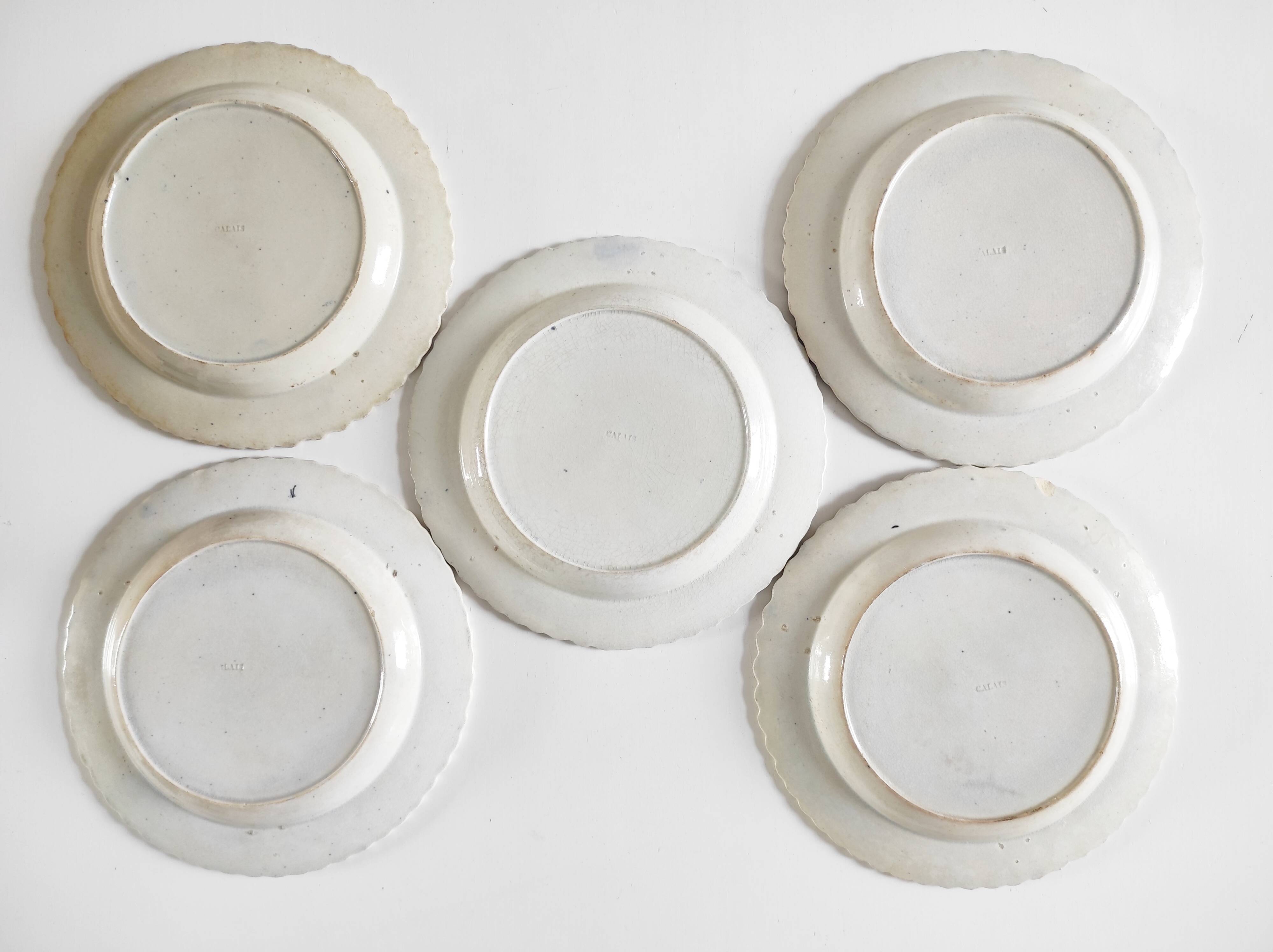 Five 19th century Calais earthenware plates with a romantic gallant couple decor