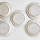 Five 19th century Calais earthenware plates with a romantic gallant couple decor
