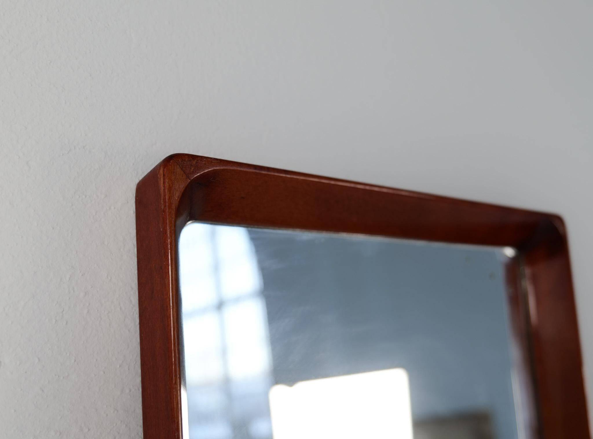 Modern Swedish mirror in mahogany from the 1940s.
