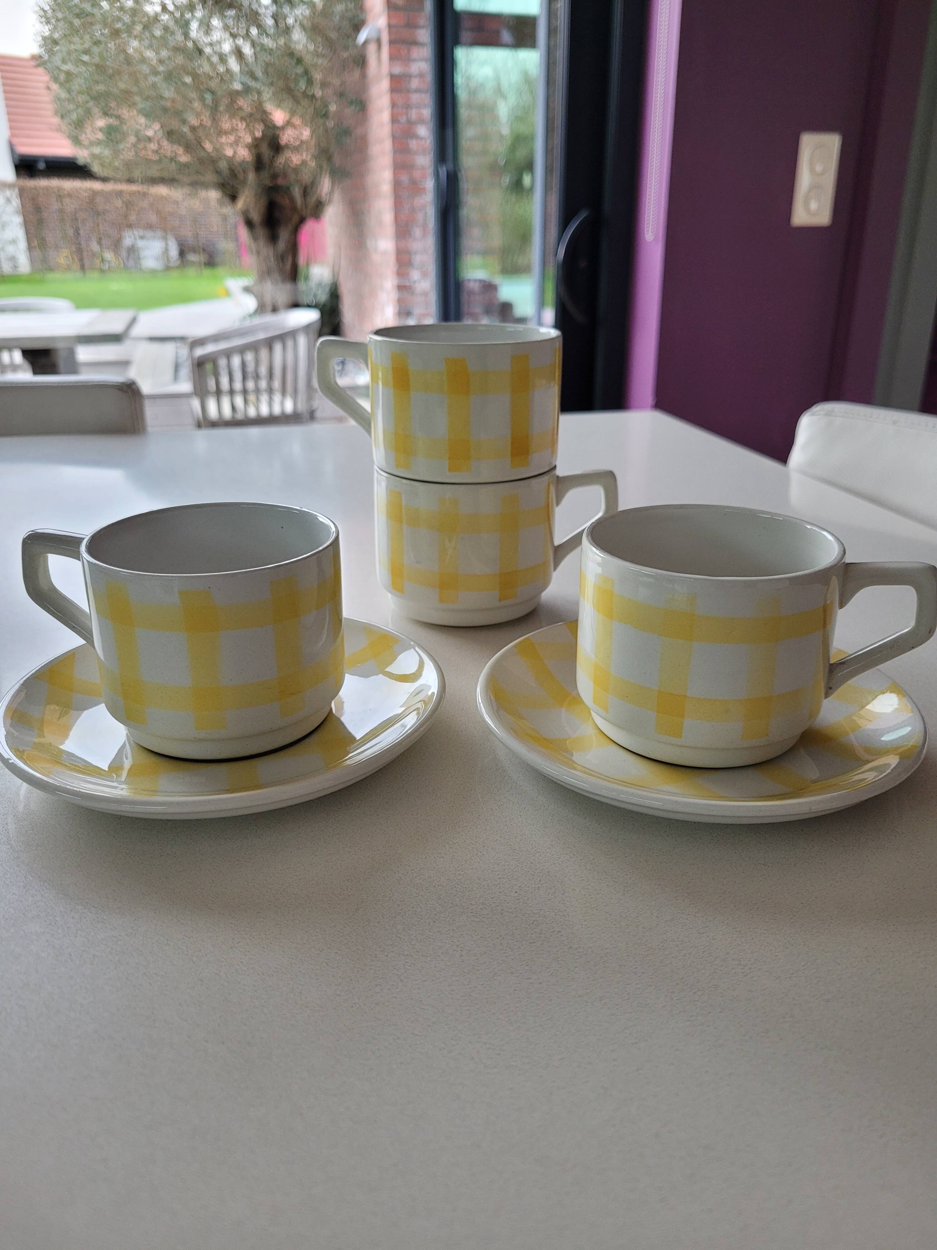 4 cups, 2 under cups yellow and white tea towel pattern