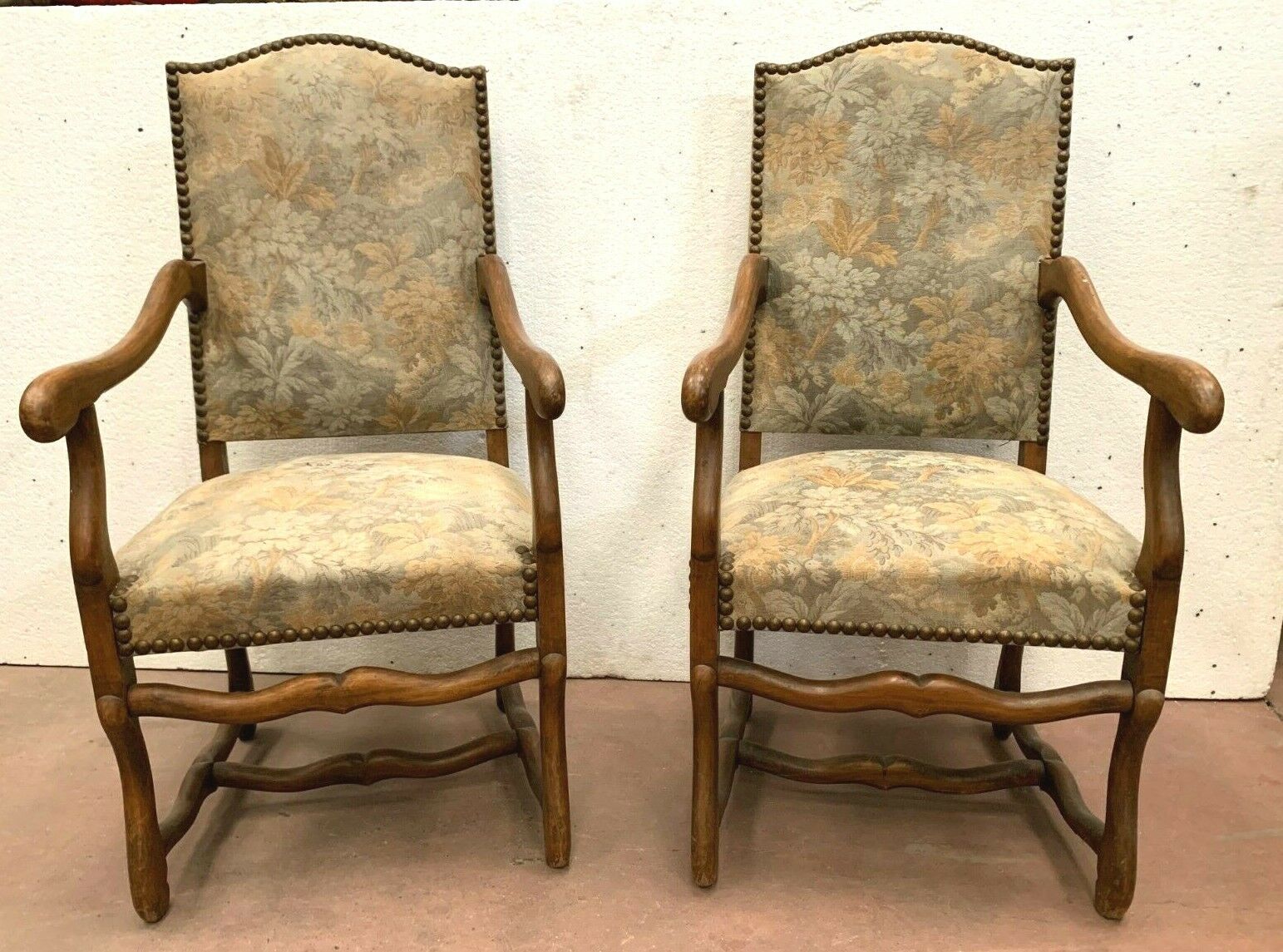 Pair of renaissance style armchairs in tinted beech XX century