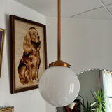 Opaline white globe pendant light with metal stem, Art Deco style.
