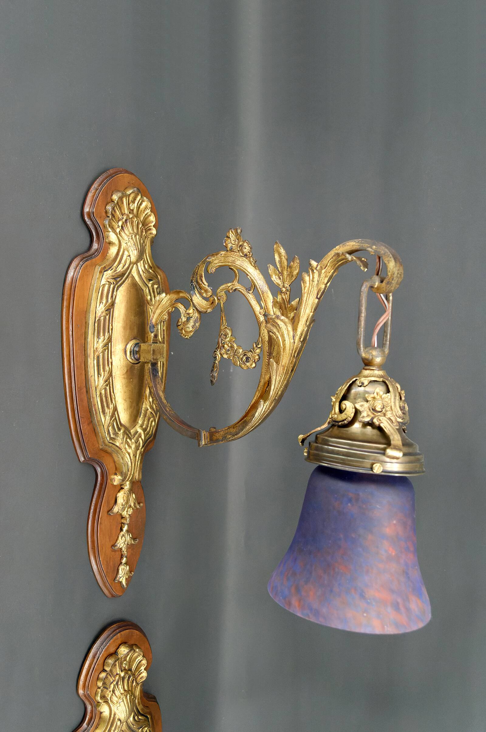 Pair of Rococo / Louis XV wall lights in gilded bronze, walnut bases and glass tulips, France, Circ