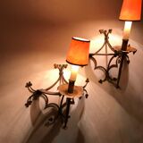 Pair of gilded metal sconces decorated with clovers.