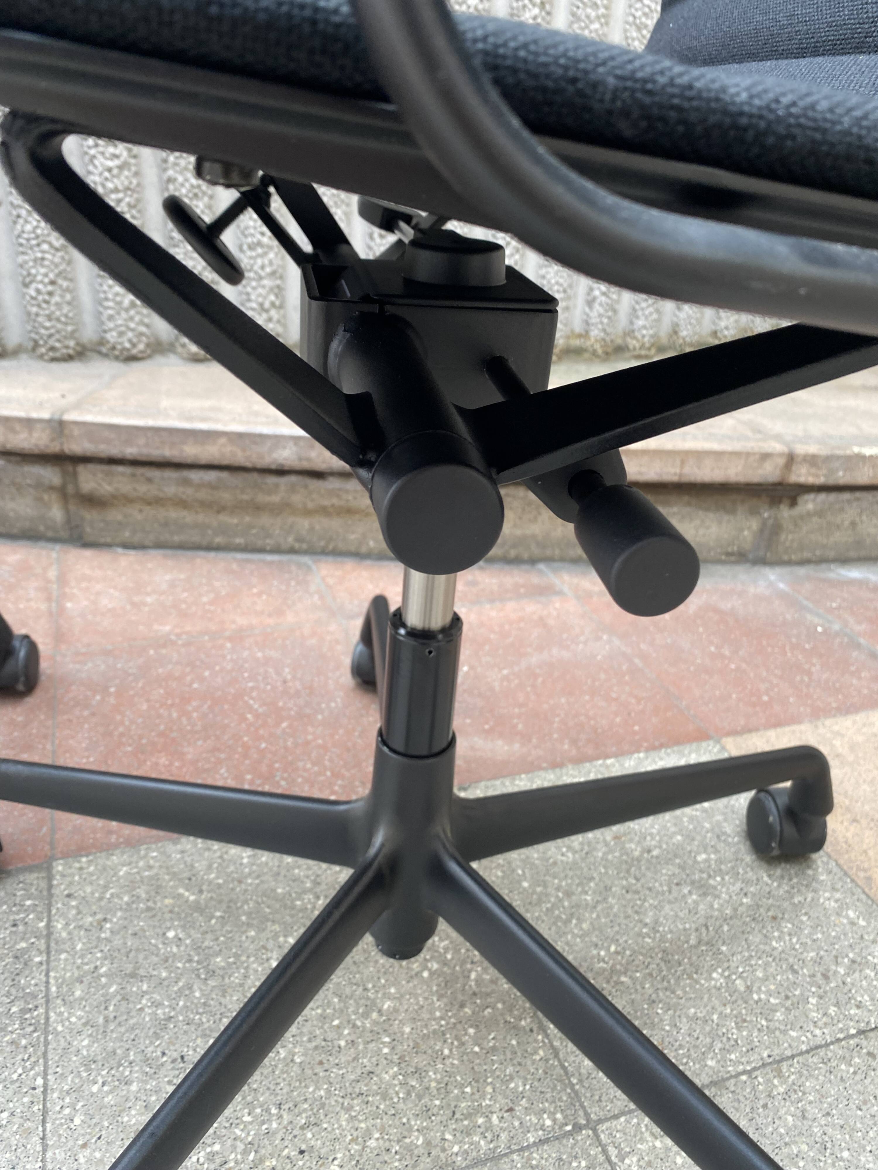 2 Charles Eames EA118 armchairs