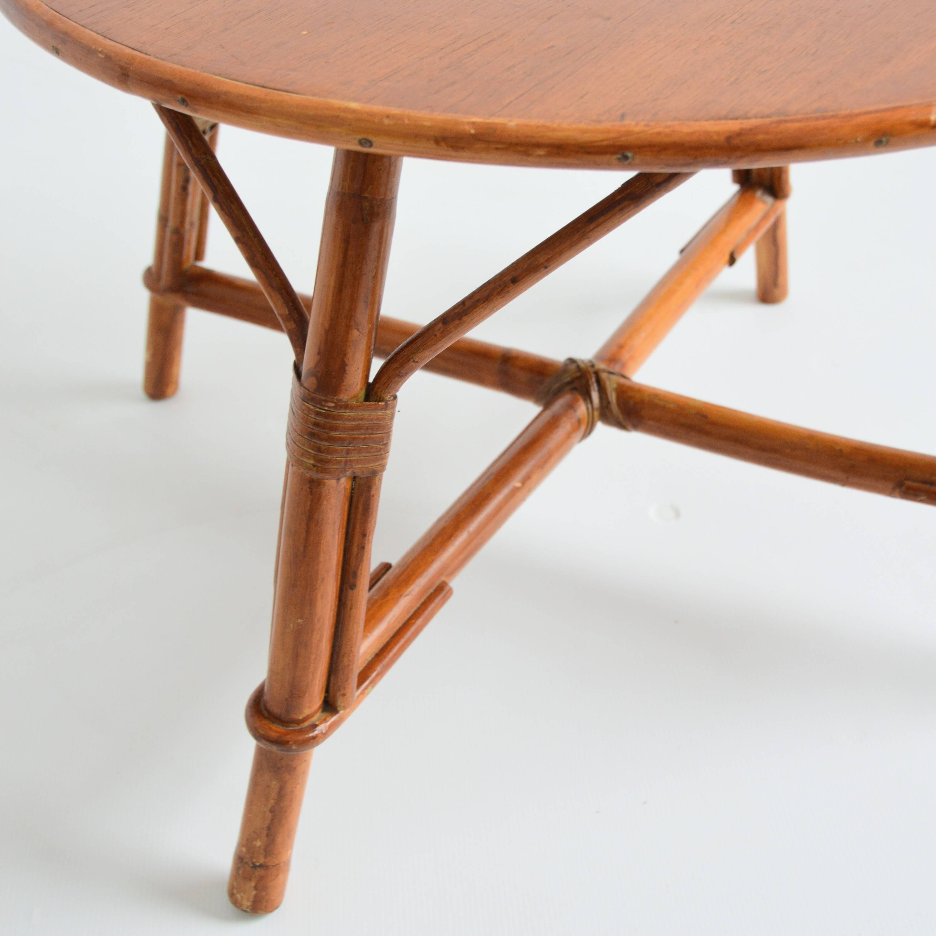 Vintage 1960s round wood and rattan coffee table