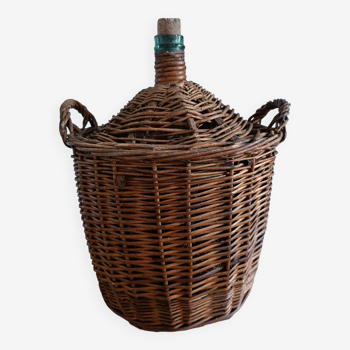 Dame Jeanne in her wicker and rattan dressing