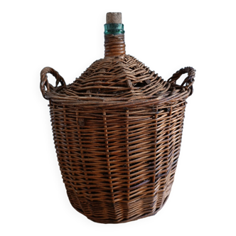 Dame Jeanne in her wicker and rattan clothing