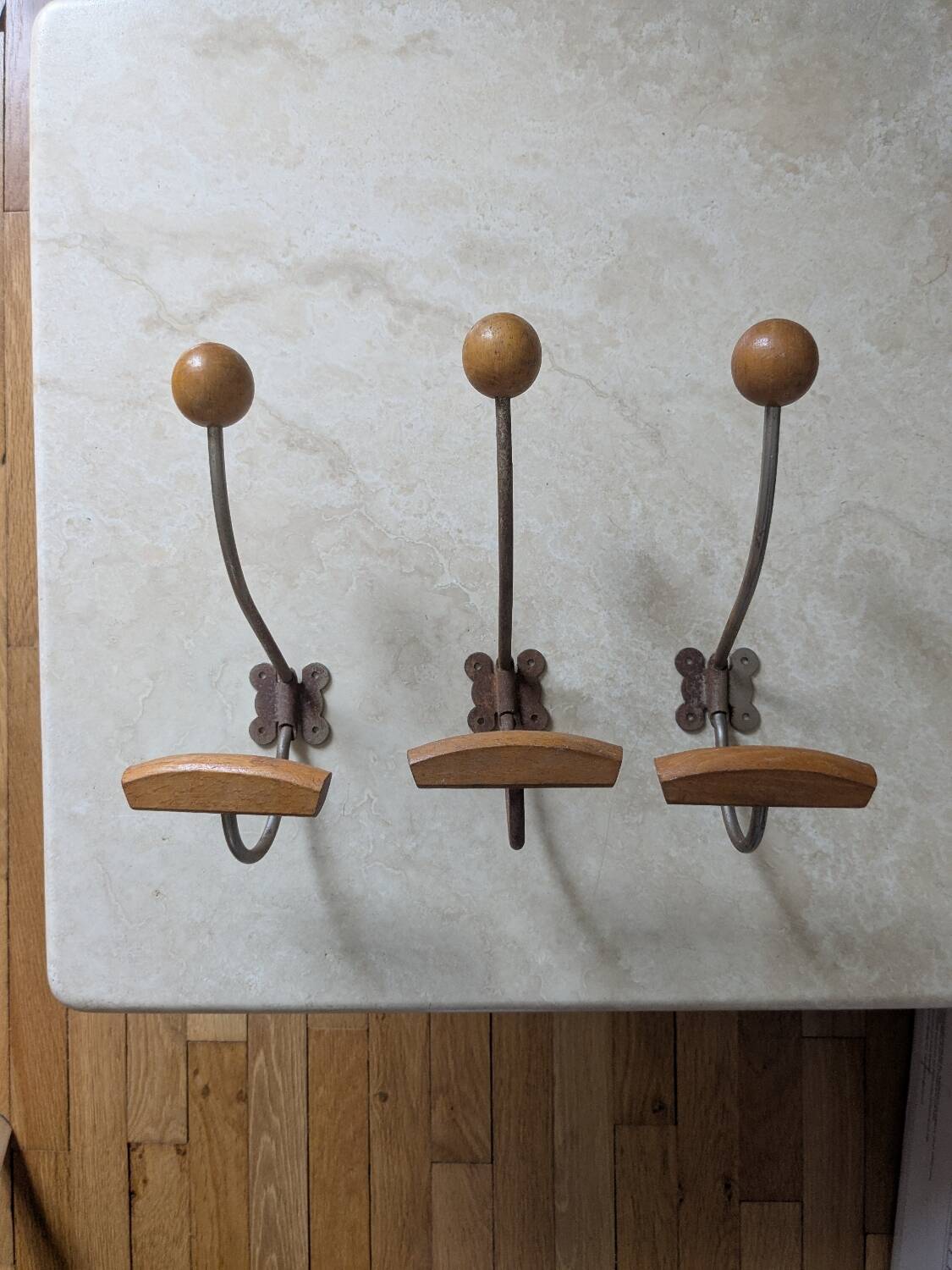 Three vintage coat hooks