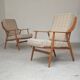Pair of Boomerang-style armchairs in ecru beige fabric, 1960s.