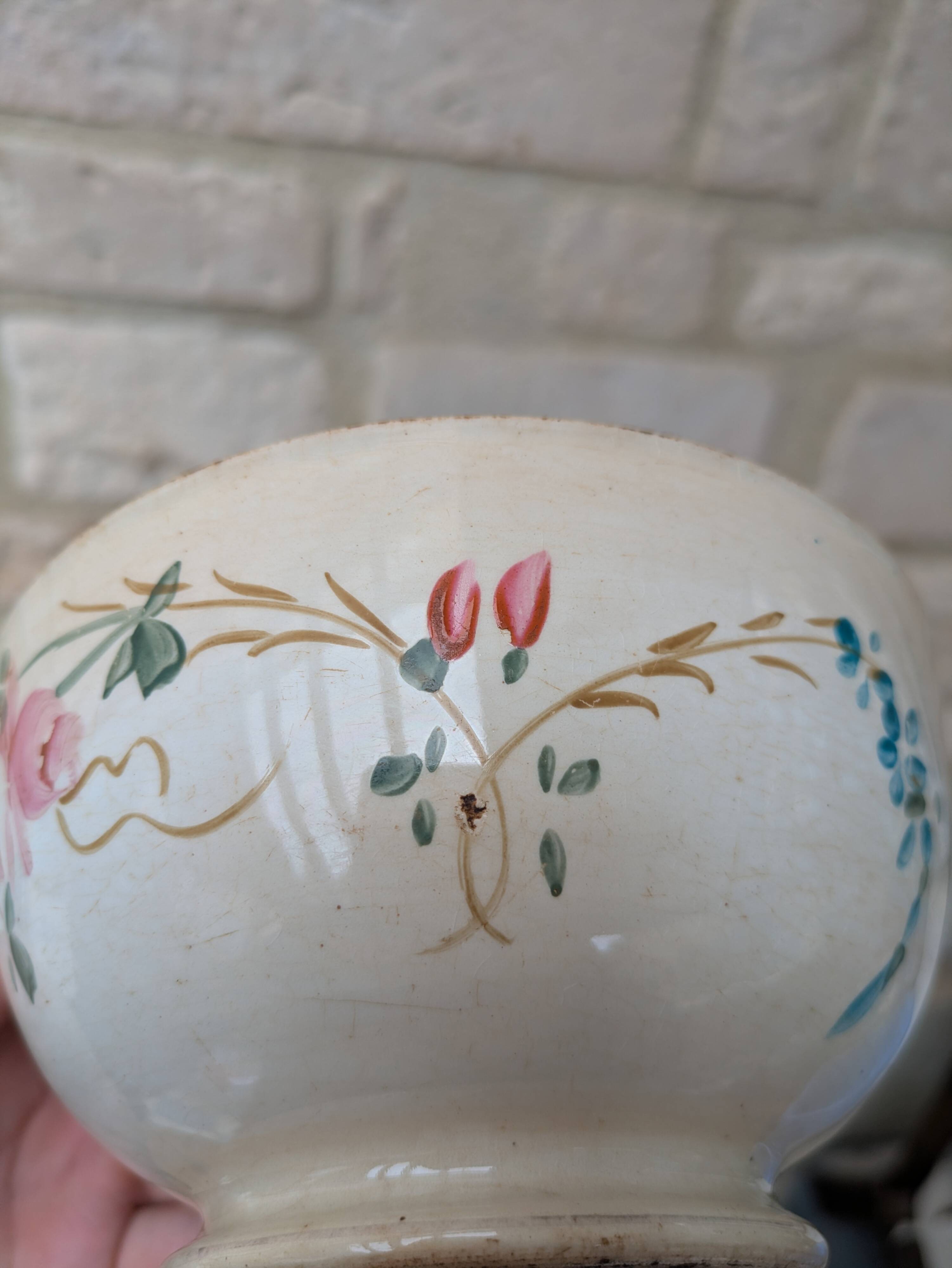 Old opaque porcelain bowl from Gien with a floral decoration.