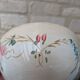 Old opaque porcelain bowl from Gien with a floral decoration.