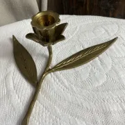 Flower candlestick and removable ashtrays in solid brass.