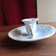 Antique handheld candle holder in porcelain