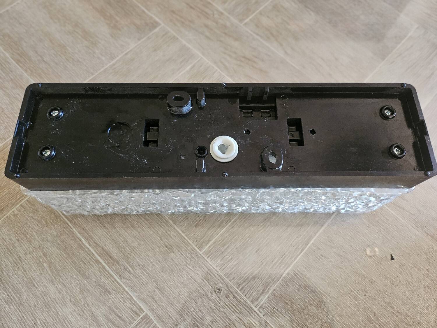 Hammered glass wall light