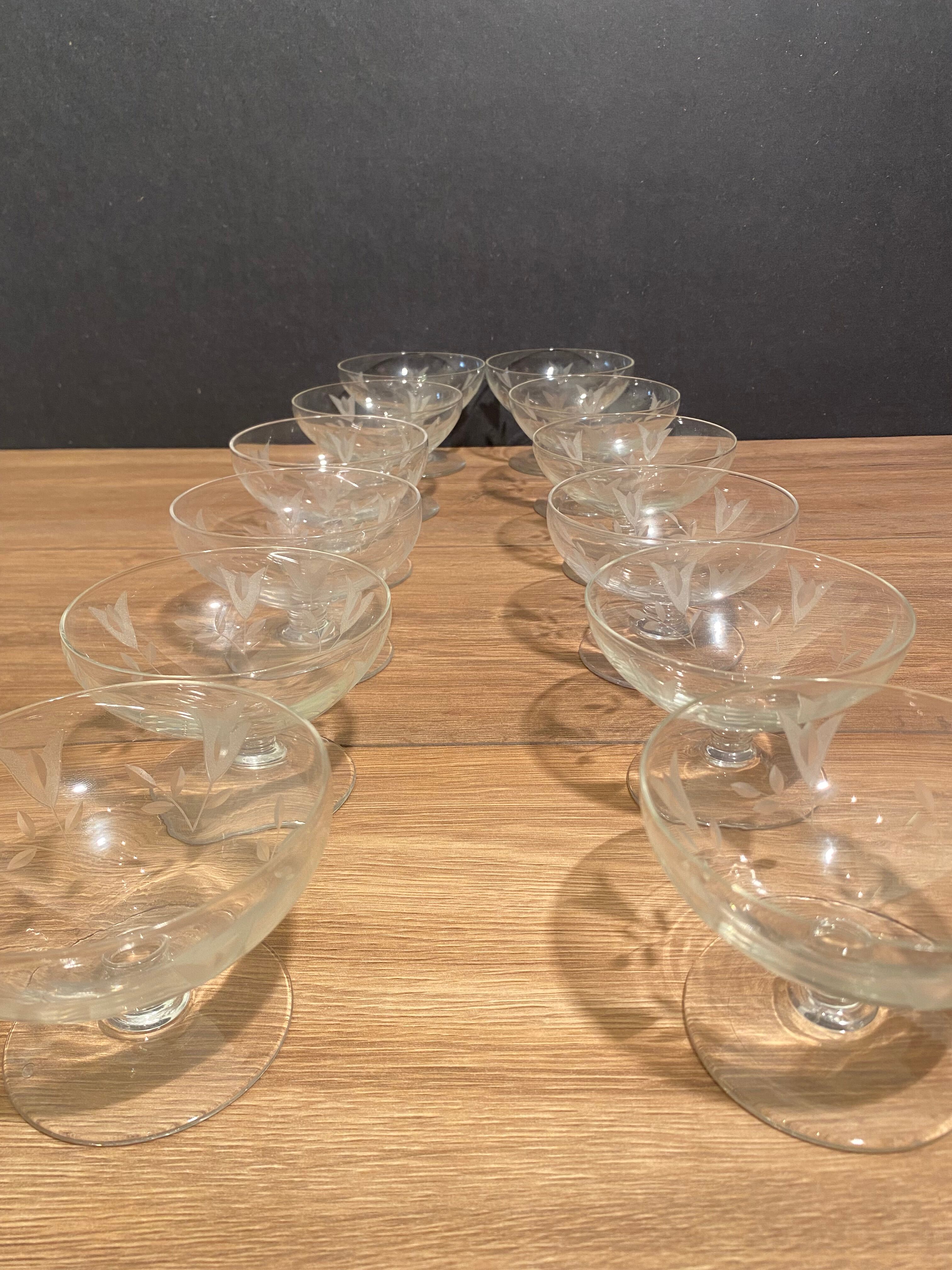 Suite of 12 champagne glasses in cut glass with floral decoration