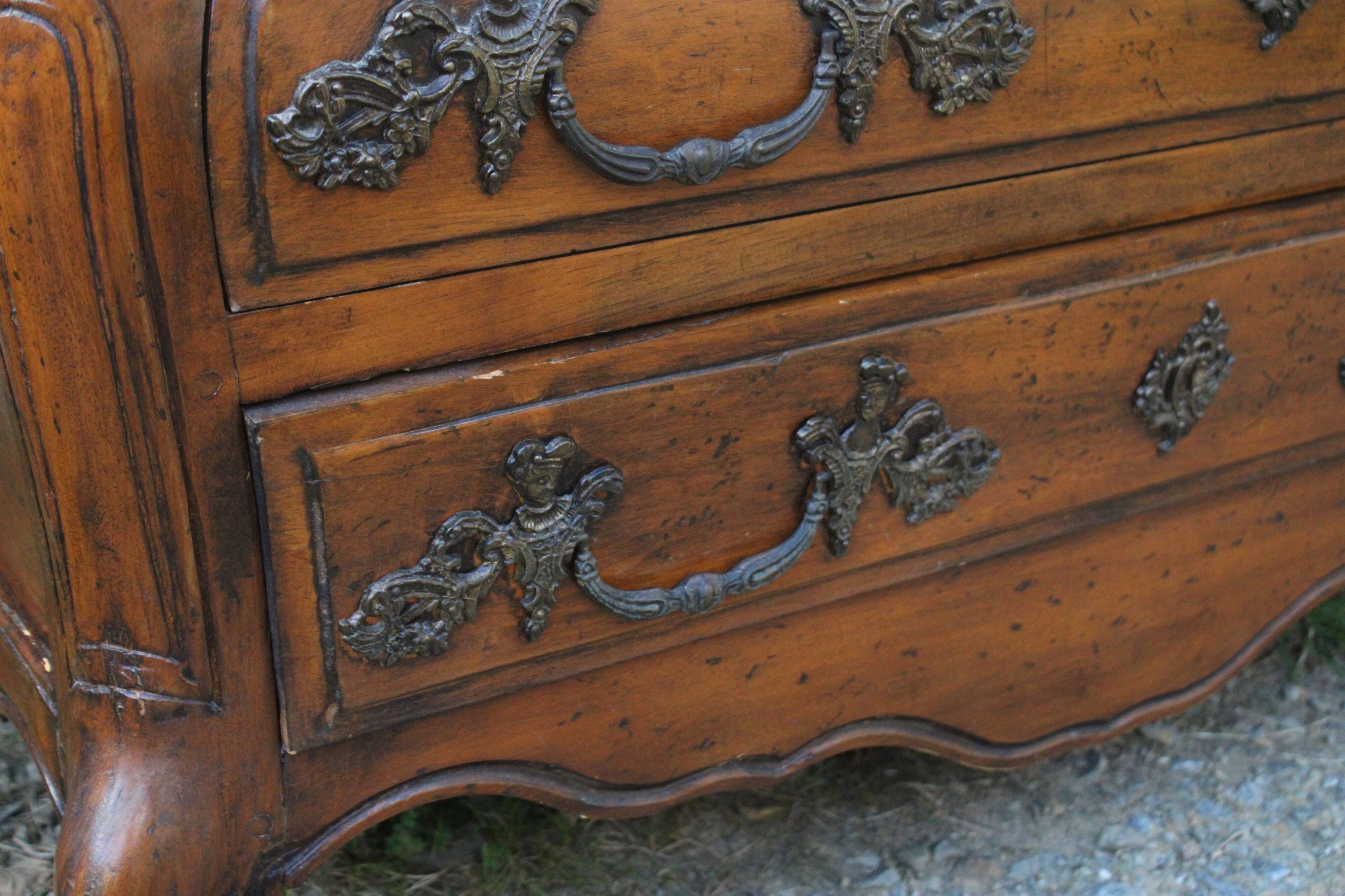 Curved Louis XV style chest of drawers known as a “tomb”