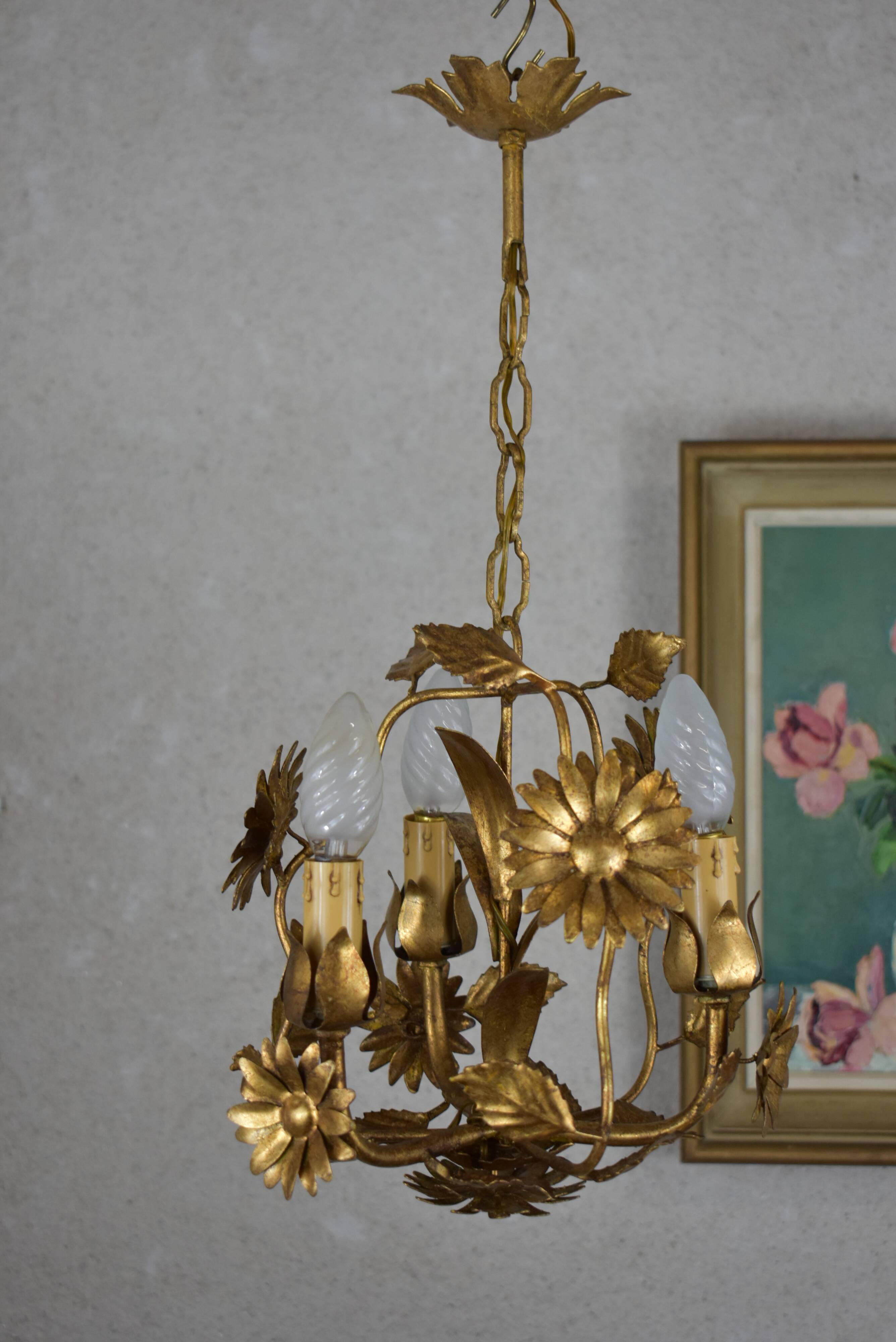 golden chandeliers with flowers.