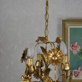 golden chandeliers with flowers.