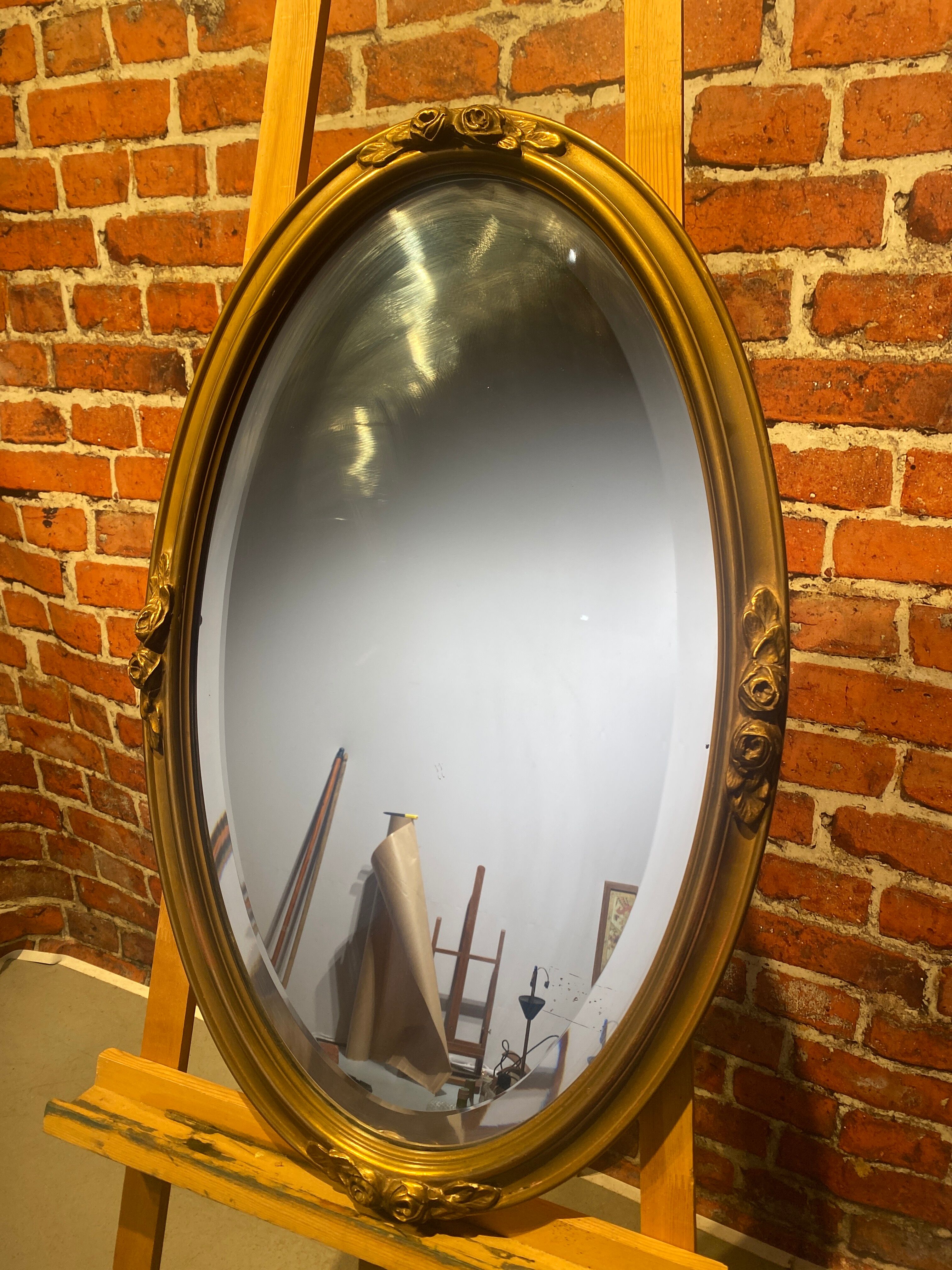 Oval mirror with wooden frame