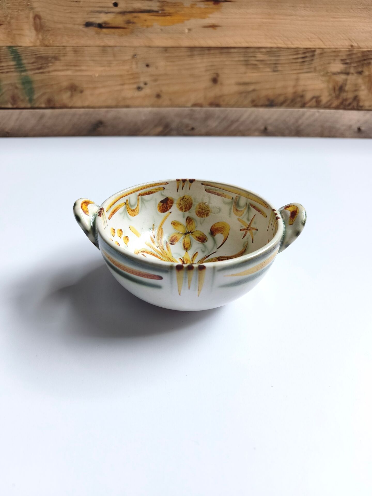 Vintage bowl signed Keraluc Quimper in yellow and green.
