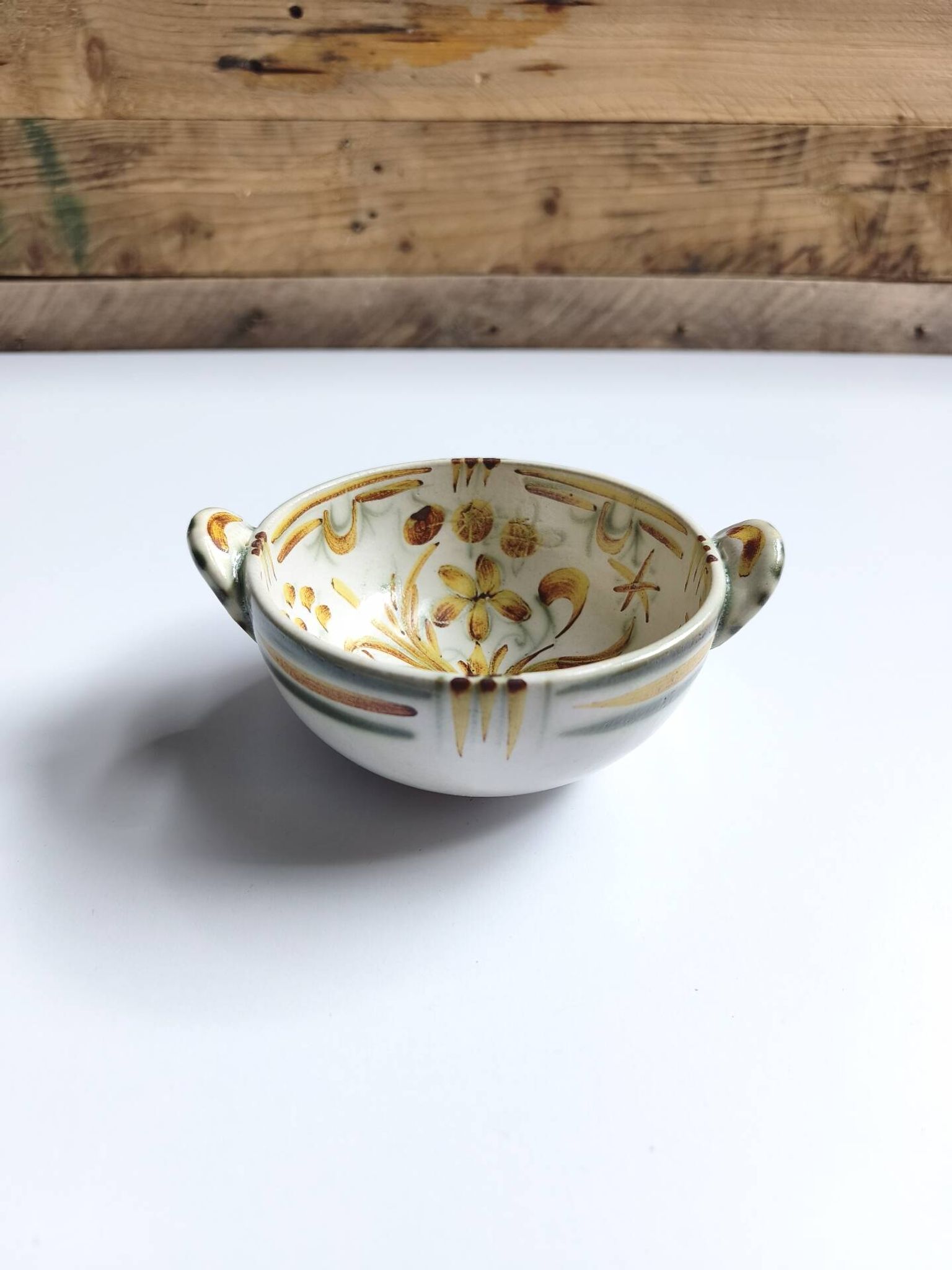 Vintage bowl signed Keraluc Quimper in yellow and green.
