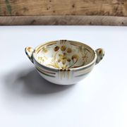 Vintage bowl signed Keraluc Quimper in yellow and green.