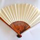 Vintage bamboo fan with floral decoration from China.