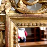 Miroir en bois doré, style Louis XVI – 1ère partie XXe - 60x30cm