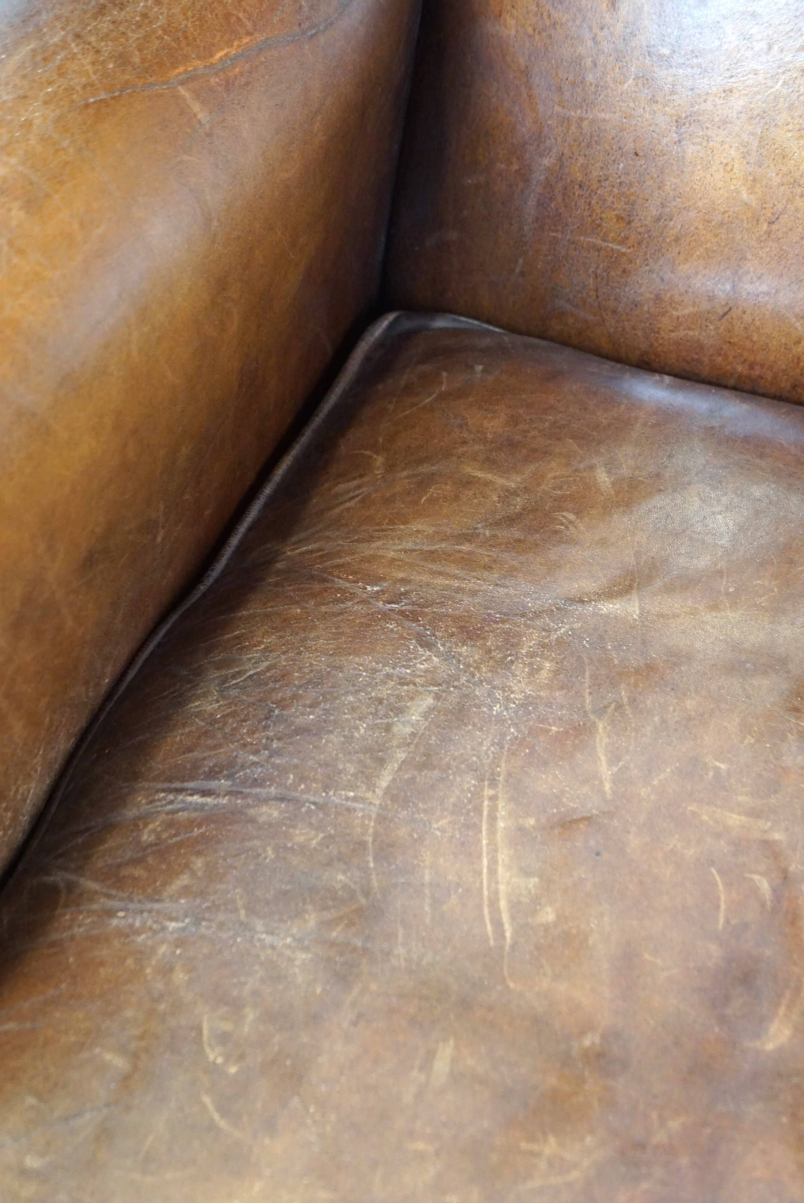 Especially comfortable wingback chair made of sheepskin leather, stunning colors