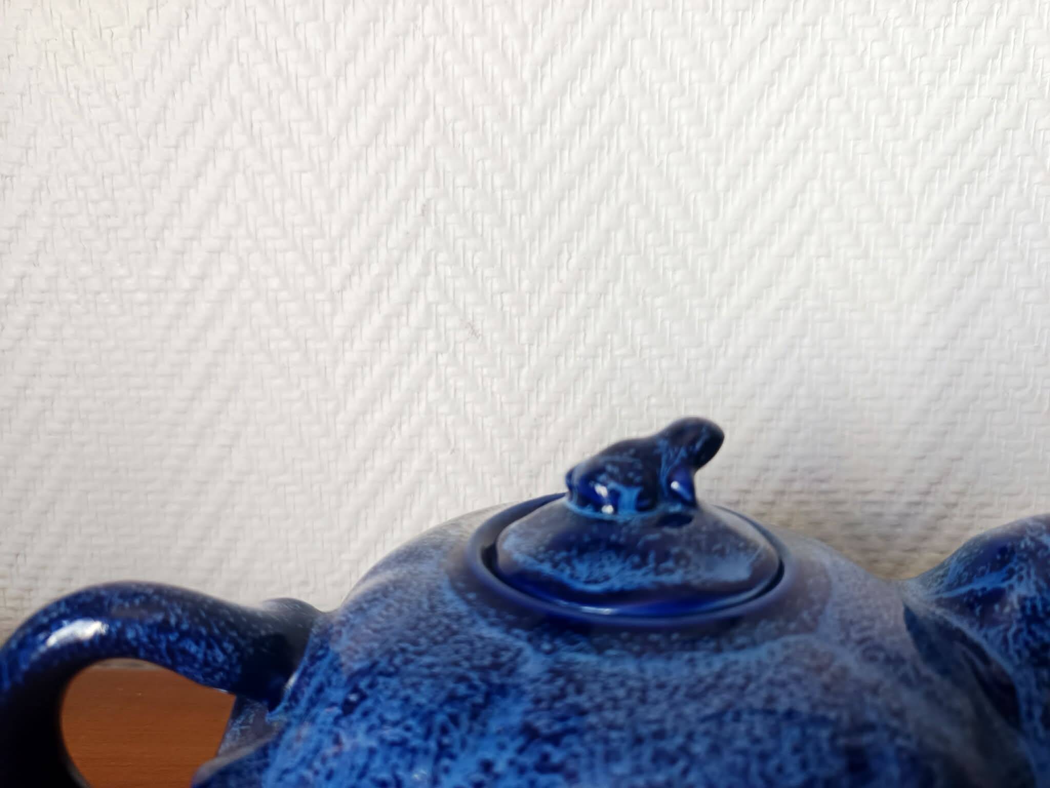 Blue ceramic Art Deco teapot with a frog.